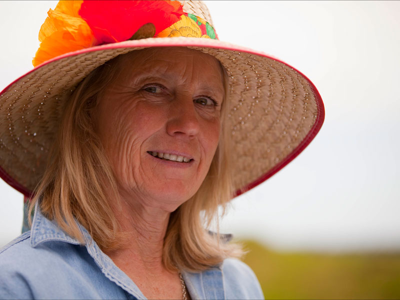 Woman wearing a sun hat and smiling